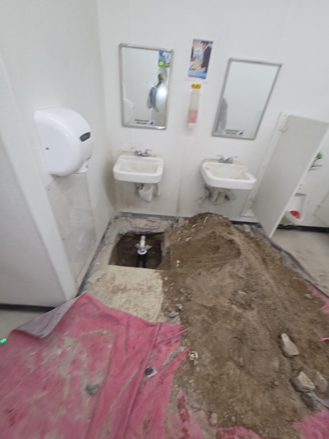 Restroom floor repair in progress